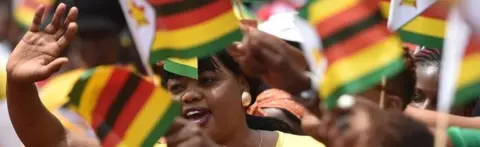 AFP/Getty Images Zimbabweans greet the new president at Harare's stadium. Photo: 24 November 2017