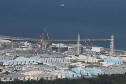 Getty Image This aerial image shows a storage tank for storing processed water on the Tepco's disabled Fukushima Daiichi nuclear power plant