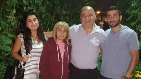 Miriam Jarjour Faraj Jarjour (second from right) with his two children and wife