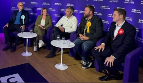 On the panel are Dan Barker (Reform UK), Sara Britcliffe (Conservative), Jack Lenox (Green), John Potter (Liberal Democrats), and Oliver Ryan (Labour)