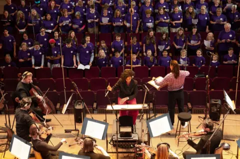 Royal Philharmonic Orchestra Shirley Thompson conducting during the recording of the anthem for the Women's Euros