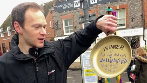 Adult-race winner Hal McKend with his golden frying pan