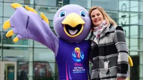 Netball World Cup 2019 Event organiser Lindsay Impett with world cup mascot Jude the Liver Bird