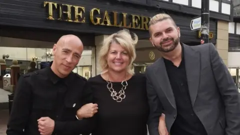 Wigan Council  Artists Al Taylor and Al Holmes with chief executive of Wigan Council Alison McKenzie-Folan