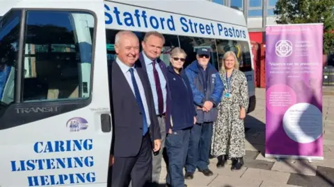 Stafford Borough Council Outside bus l-r Ben, Jeremy, Jeanne Trevor and Victoria