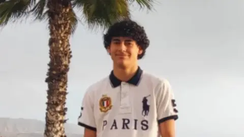 GoFundMe Luis Gabriel Guembes - a teenager in a white polo top, with black curly hair.