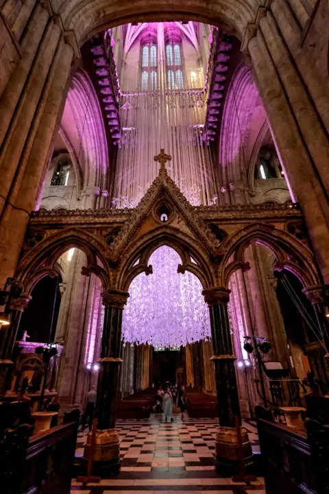 Durham Cathedral/NNP The Peace Doves installation, comprising thousands of handmade paper birds, hanging at Durham Cathedral