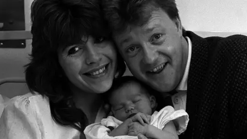 PA Maggie Philbin and Keith Chegwin with their daughter