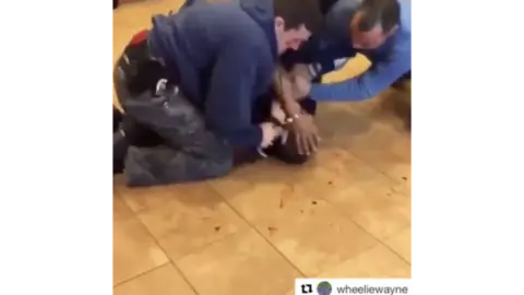 Computational Propaganda Research Project White policemen hold down a black man on a blood spattered floor