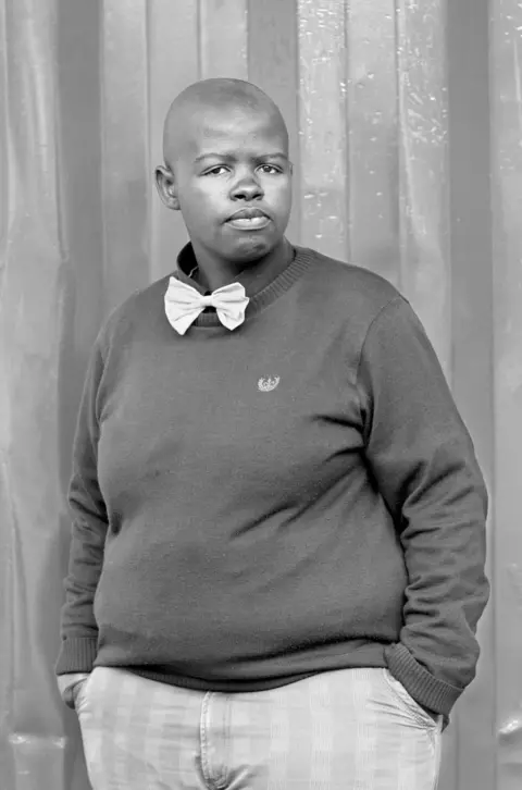 Zanele Muholi Person wearing bow tie and sweater