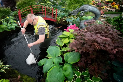 PA Media Preparations get underway ahead of the RHS Chelsea Flower Show at the Royal Hospital Chelsea in London.