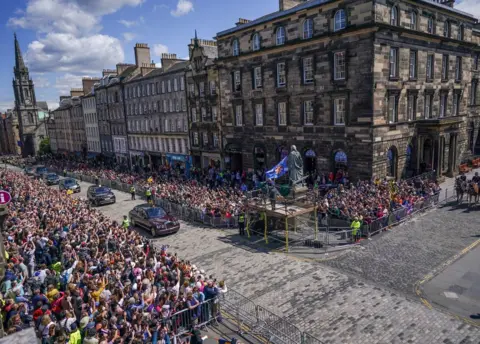 Reuters Crowds of people gather at St Giles