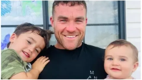 Matthew Syron Matthew Syron with his two children