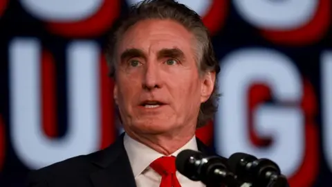 Getty Images Mr Burgum speaking at a campaign event