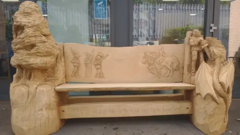 BBC A carved bench