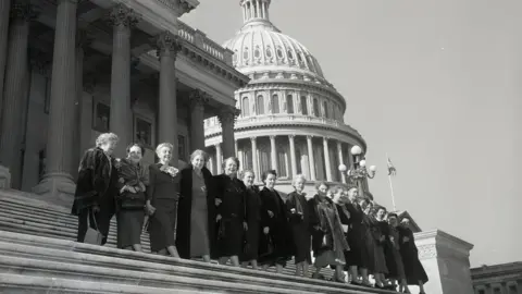 Bettmann via Getty All of the 17 ladies serving in the 84th congress posed for this photo on the house steps of the Capitol in 1955