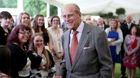 PA Media Duke of Edinburgh attending the Presentation Reception for The Duke of Edinburgh Gold Award holders in the gardens at the Palace of Holyroodhouse in Edinburgh - 2017