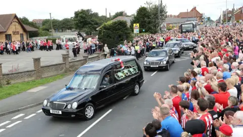 PA Media Mourners line the streets at Bradley Lowery's funeral in 2017