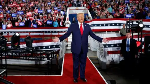 Getty Images Donald Trump greets a crowd during his campaign for President