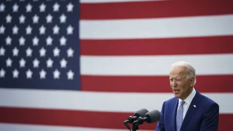 Getty Images Joe Biden speaks during a campaign event at the Mountain Top Inn and Resort on 27 October in Warm Springs, Georgia