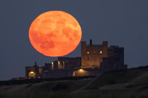 Dan Monk Moon over Bamburgh Castle