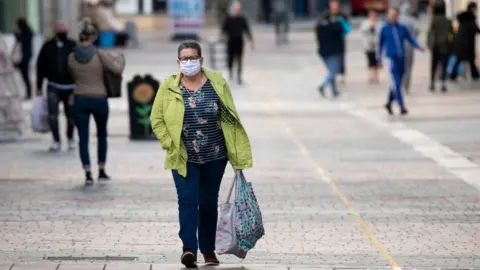 Getty Images Woman walking in Merthyr Tydfil