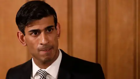 Getty Images Chancellor of the Exchequer Rishi Sunak speaks during a daily press conference at 10 Downing Street.