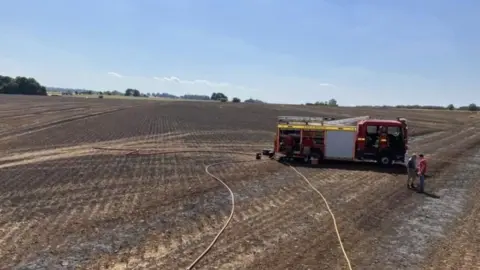 Avon Fire and Rescue Service A fire engine on scorched fields