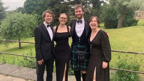 Bea Bennett The four students in formal evening dress