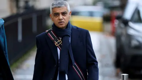 Reuters London Mayor Sadiq Khan walks on the day he gives evidence at the COVID-19 Inquiry, in London, Britain, November 27, 2023