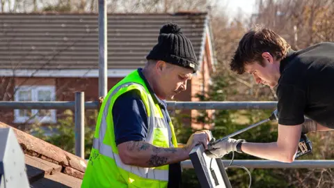 Ashden Workers fitting solar panels