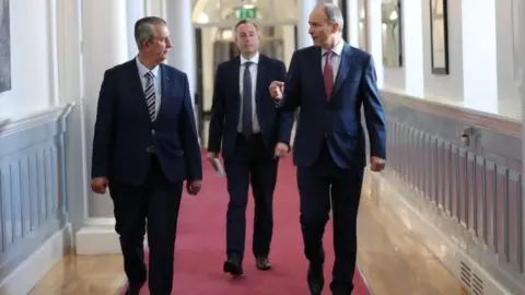 PA Media Edwin Poots, Paul Givan and Micheál Martin