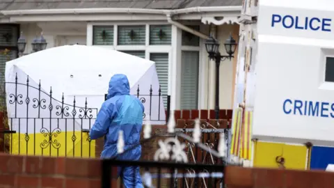 PACEMAKER Forensic teams at the scene of the killing on Etna Drive on Saturday