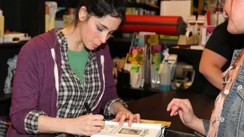 Getty Images Sarah Silverman signs copies of her book