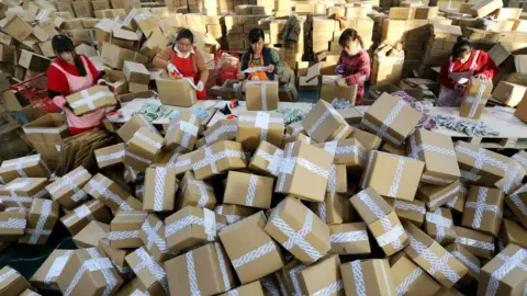 AFP/Getty Workers prepare packages for delivery at a sorting centre in Lianyungang, Jiangsu province during the Singles Day online shopping festival on 11 November 2016.