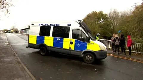 Police van at the site of the illegal rave in Yate near Bristol