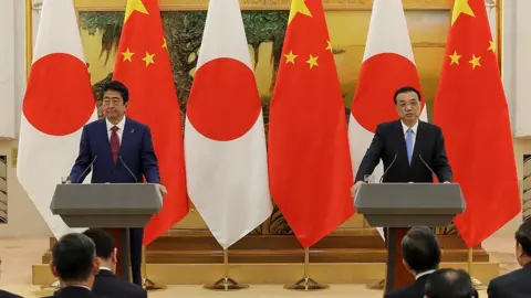 Getty Images Shinzo Abe and Li Keqiang