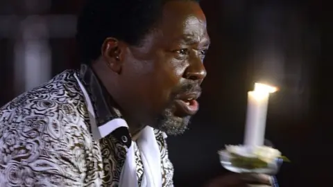 AFP Nigerian pastor TB Joshua speaks during a New Year's memorial service for the South African relatives of those killed in a building collapse at his Lagos megachurch on December 31, 2014