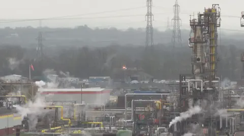 Smoke rises from Stanlow oil refinery in Ellesmere Port