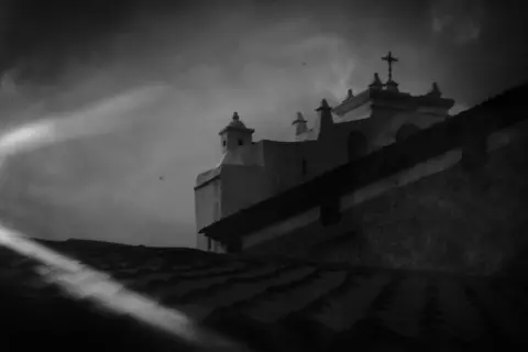 James Rodriguez Late afternoon sun shines on the Catholic Church in Chajul. Chajul, Quiche, Guatemala. February 11, 2021.