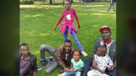 Abdalaziz Osman Mustafa with members of his family