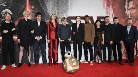 Getty Images Rian Johnson (far right) with cast members from The Last Jedi