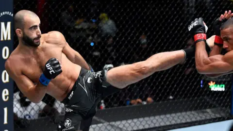 Giga Chikadze throws a kick