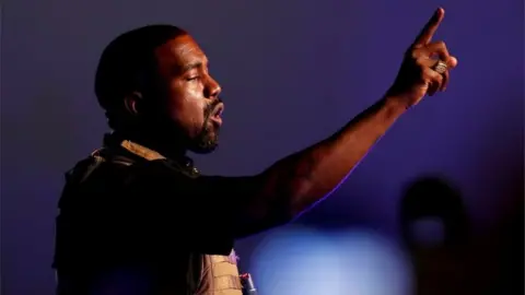 Reuters Kanye West gestures at his first rally for US president