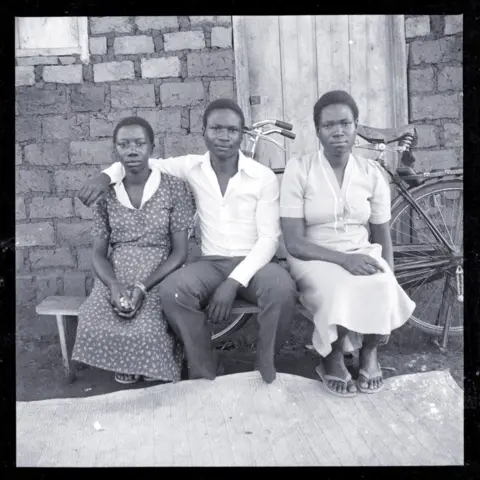 Ssalongo/Mwine Portrait of three people