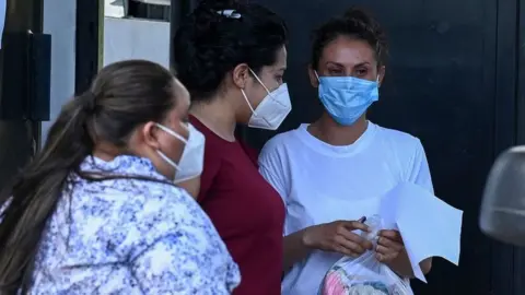 Sara Rogel talks whit relatives after being released from the Zacatecoluca Penal Center in Zacatecoluca, El Salvador