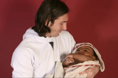  Joan Monfort/AP Lamine Yamal as a baby with Lionel Messi in 2007