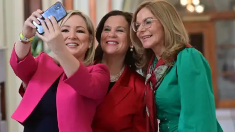 PAcemaker Sinn Fein's Michelle O'Neill, Mary Lou McDonald and Tina Black celebrate at Belfast City Hall