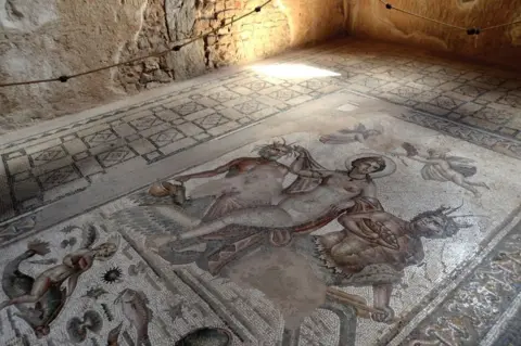 Corbis News/Getty Images Mosaic from the House of Amphitrite in Bulla Regia, the archaeological site in north-western Tunisia, a former Roman city. It is noted for its Hadrianic-era semi-subterranean housing, a protection from the fierce heat and effects of the sun ,on September 21, 2018 in Jendouba, Tunisia.