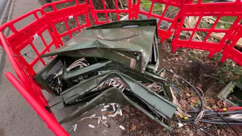 Stephen Huntley/BBC Telecoms exchange box damaged after crash